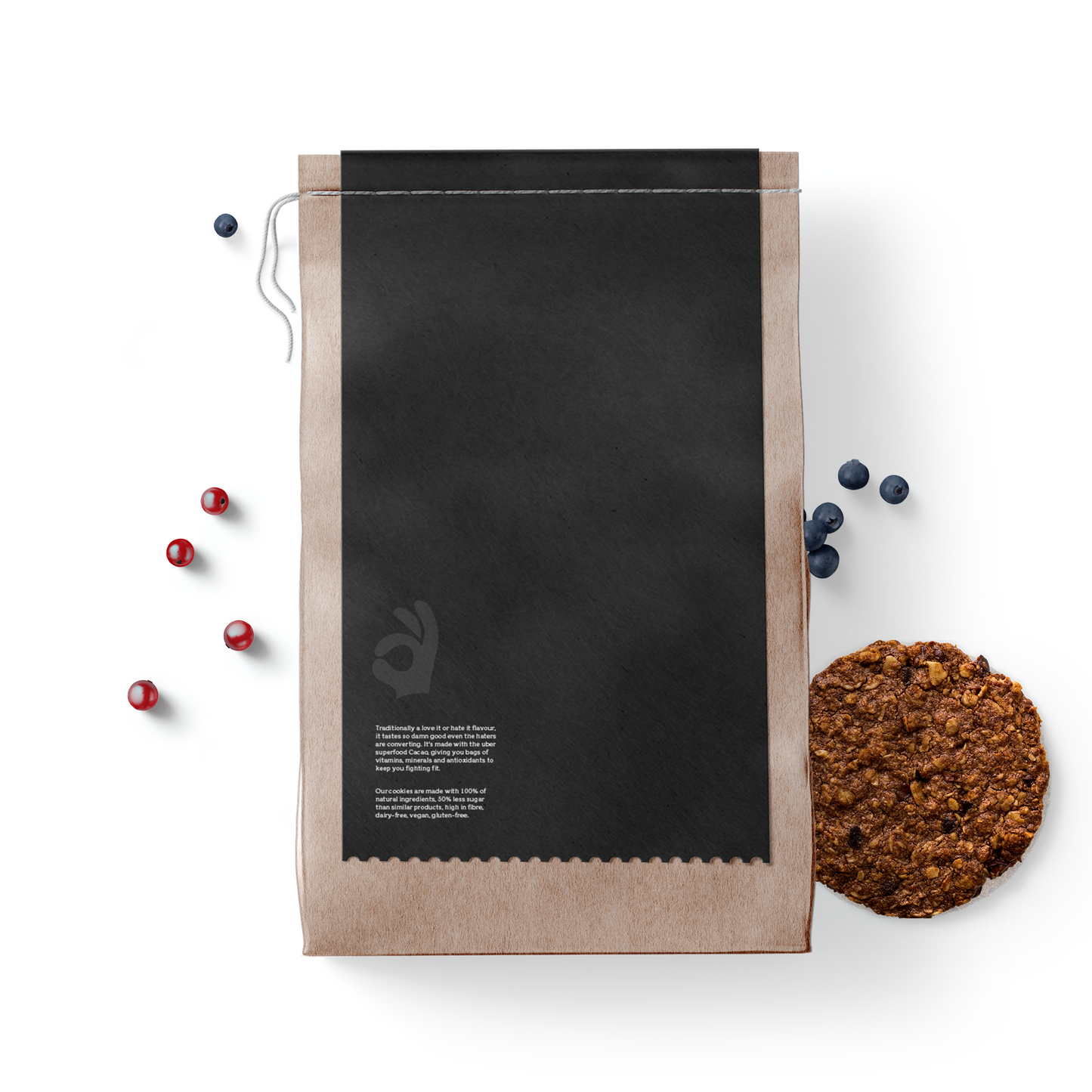 Back view of bag of Crunch On Cacao & Berry Cookies - 12 cookies, with cookie and berries in the background